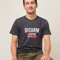 Front view of man wearing a dark gray short sleeve t-shirt with the text DISARM HATE printed in white with a red line through the word HATE.