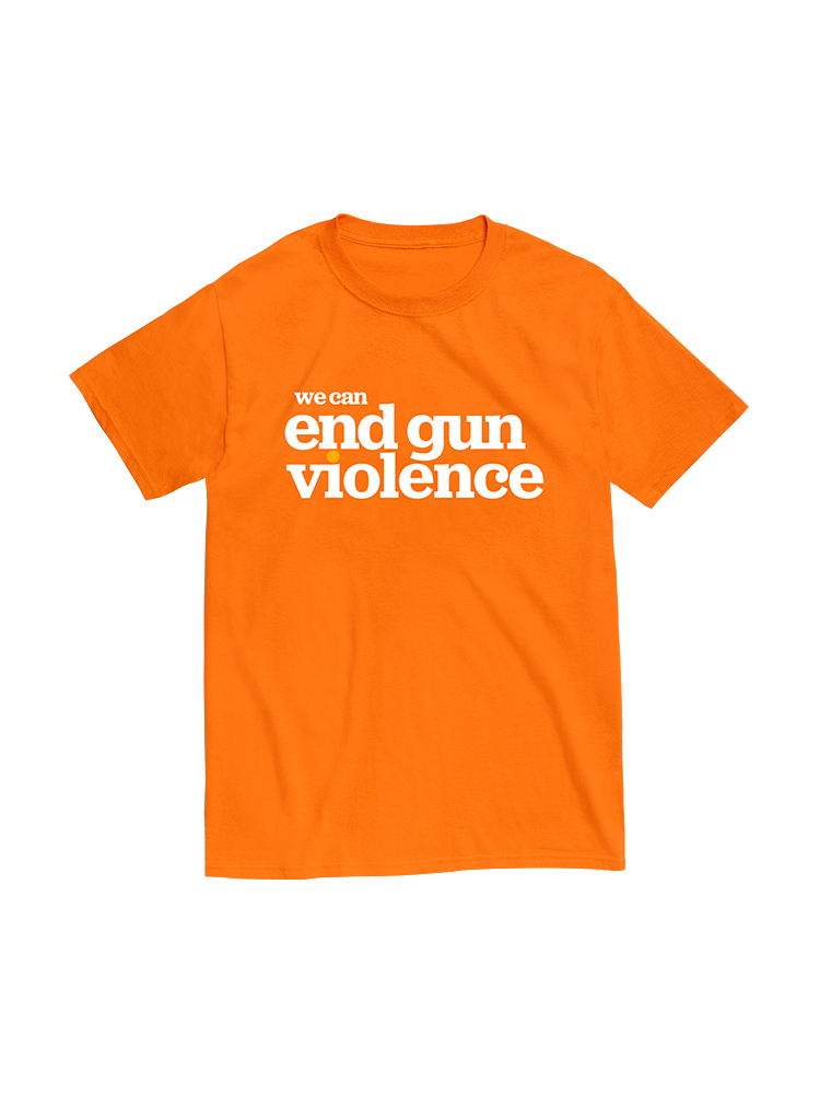 Orange short-sleeve unisex t-shirt, front view. In large white print across the chest, it reads: we can end gun violence. The dot of the i in violence is printed in light orange.
