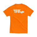 Orange short-sleeve unisex t-shirt, back view. The Wear Orange logo is printed large in white.