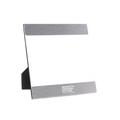 Front view of 5 x 7 inch picture frame with brushed aluminum framing on top and bottom, white Moms Demand Action logo centered on bottom, and black easel stand on back.
