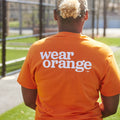 Ni Uno Más Wear Orange Tee