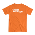 Ni Uno Más Wear Orange Tee